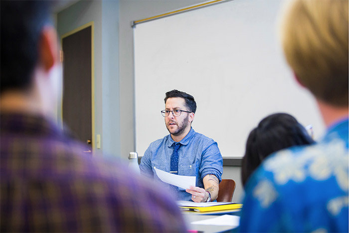 T Cooper speaks to a group of students